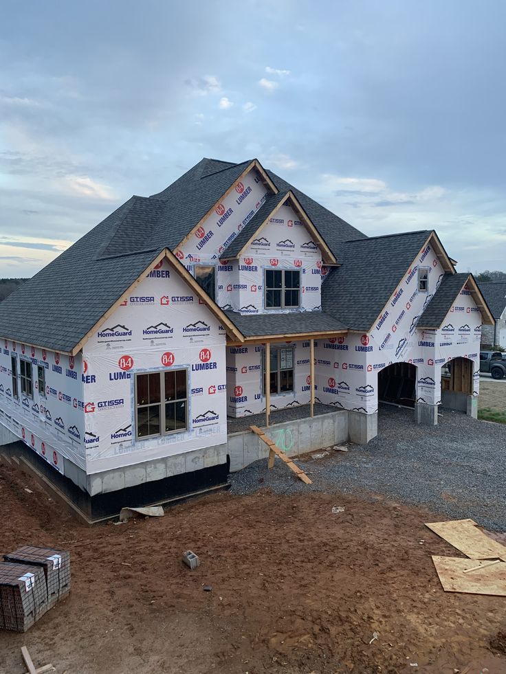 New residential home wrapped and roofed during construction